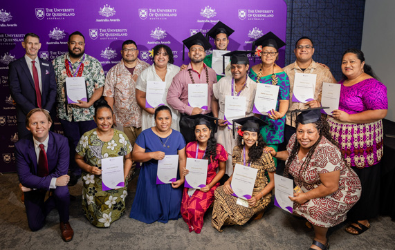 Australia Awards graduation ceremony with Sophia in the group photograph holding up her certificate