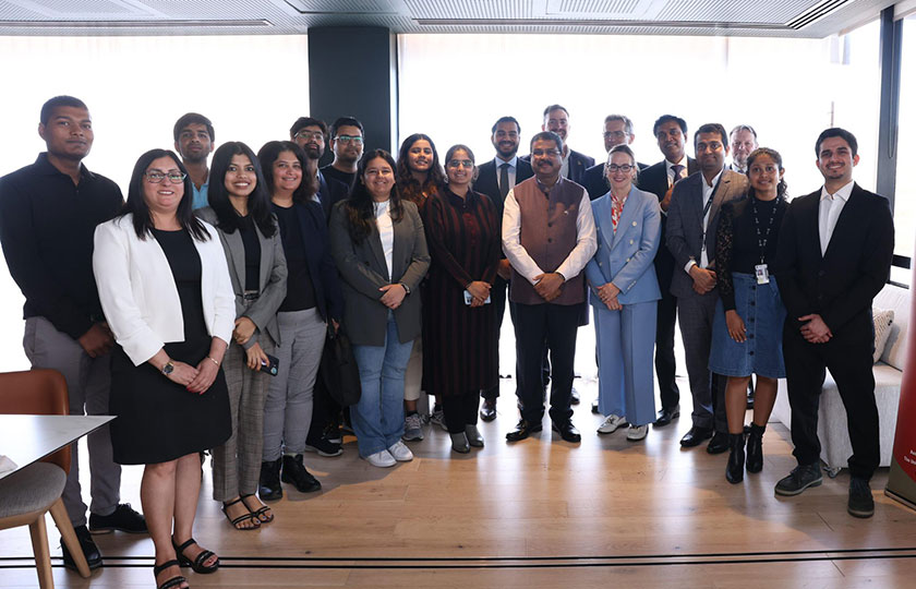 A group of people with Indian Minister for Education The Hon Dharmendra Pradhan (centre)