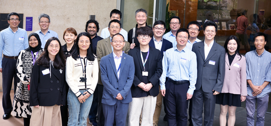 Group photo of UQ and HKUST colleagues outside the AIBN buildng at UQ