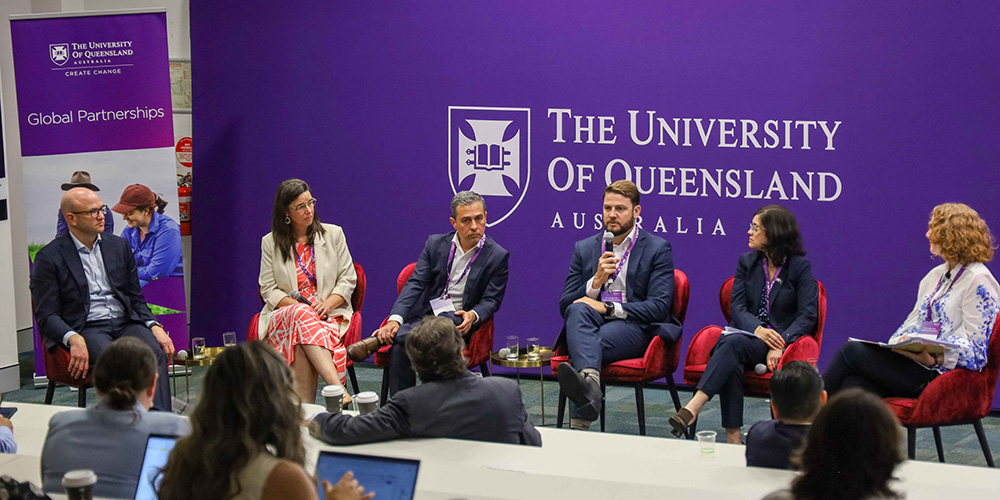 Panellists speaking as a group as part of a panel session