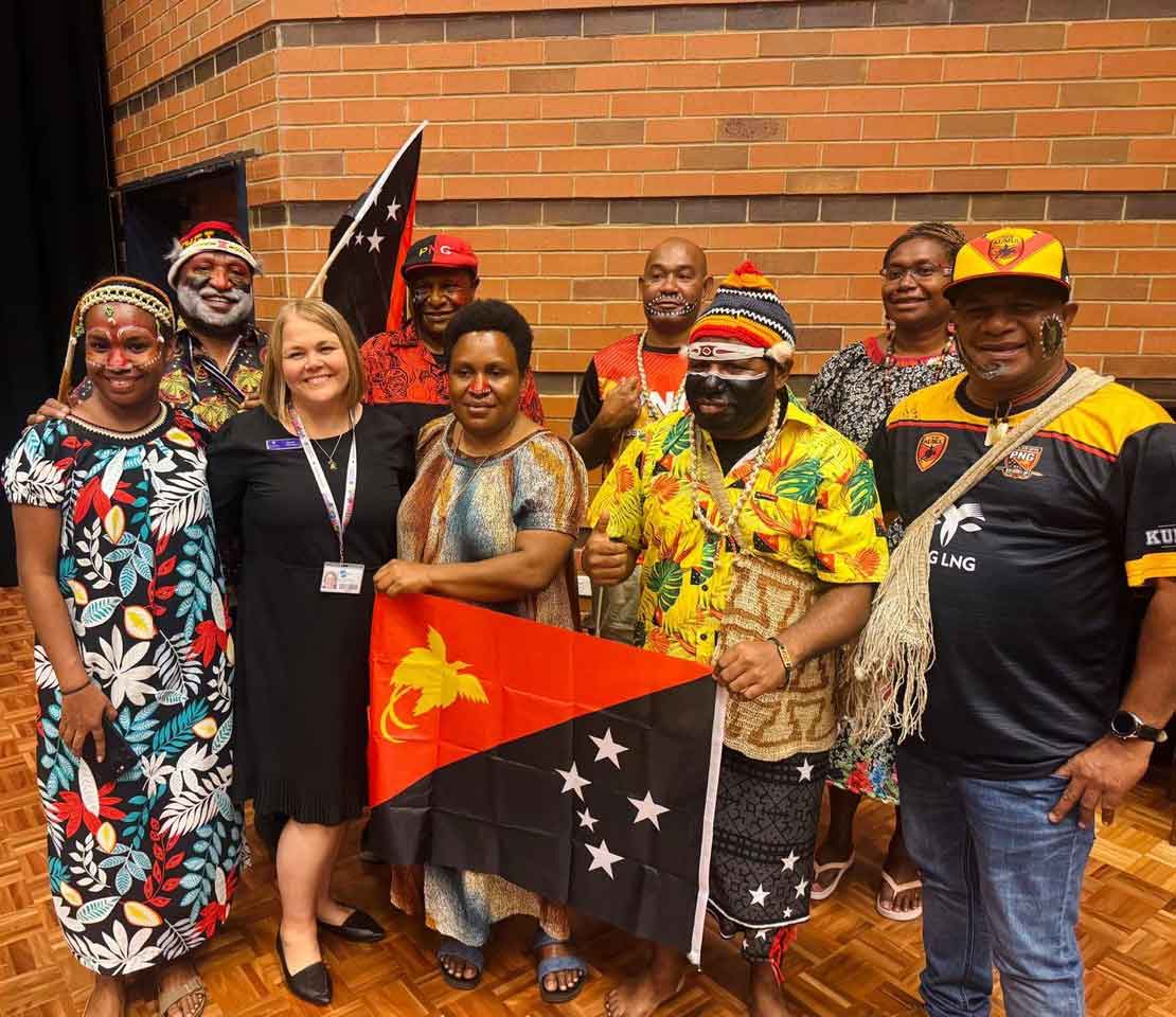 Cedric stands with other international students second from left, with Rachel Panousis third from left. 