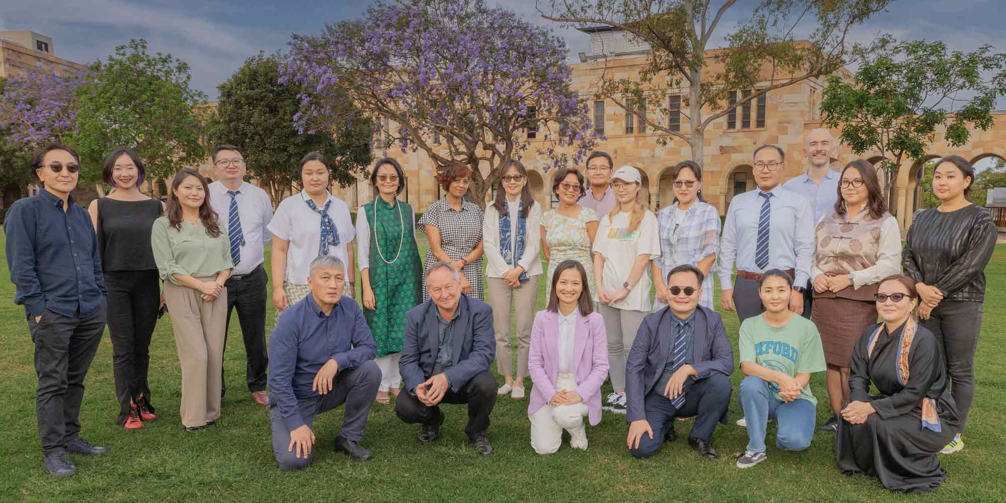 Australia Awards Fellows in UQ's Great Court with course leaders from the Centre for Social Responsibility in Mining (CSRM) and facilitators from Global Partnerships International Development