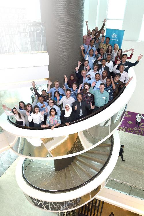 Participants in program on staircase in Indonesia