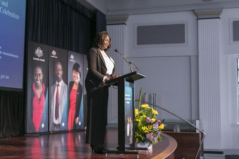 Donna Kelly on stage giving speech