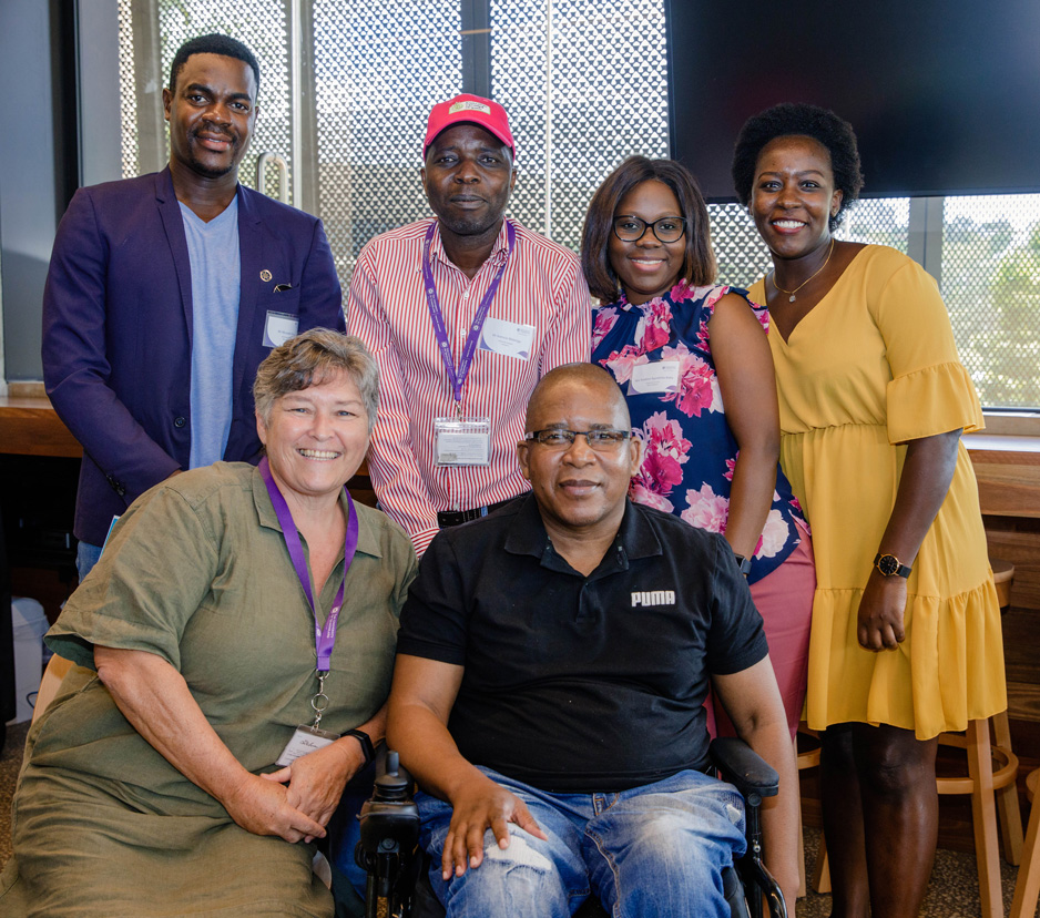 David Moatshe at 2021 Class graduation with fellow students and Fiona Pakoa, Senior Manager, Scholarships