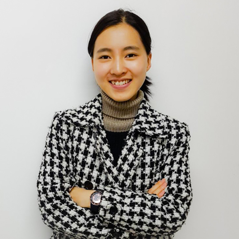 Jennifer Min in a checkered herringbone jacket