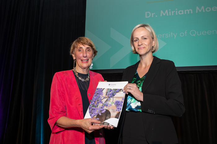 Jenny dixon standing next to Dr Miriam Moeller receiving award