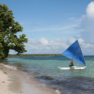 canoe approaching shoreline