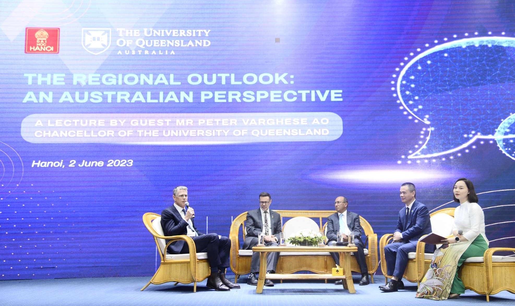 panel talk with five people in front of blue background