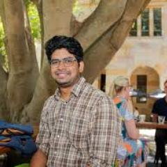 Sudeep smiling at the camera at Merlos coffee shop at St Lucia