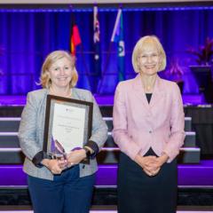 Dallas Dowsett and UQ's VC Deborah Terry at the award ceremony 