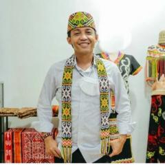 Raja Juli Antoni smiling at camera