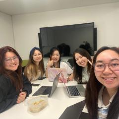 Working on a group presentation with fellow students 