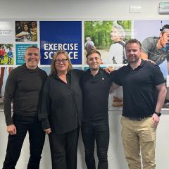 An image of Professor Mark Wilson, Associate Professor Elizabeth Edwards, Dr Jack Brimmell and Associate Professor Robert Vaughan standing together at the "Performance Under Pressure" Symposium in Exeter