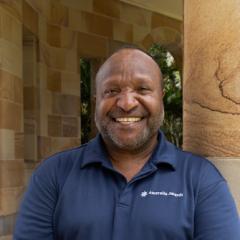 Cedric in the Great Court St Lucia wearing Australia Awards collared-shirt
