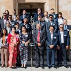 21 nepalese emerging leaders standing on UQ steps outside sandstone building