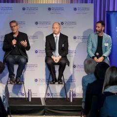 Panellists talking at launch event