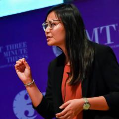 Woman presenting with 3MT branding in background