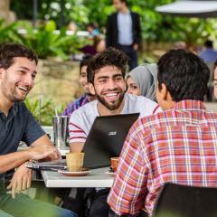Students sitting and talking at a cafe