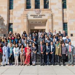 All Awardees standing on the sandstone steps at UQ outside Morgan Smith building. 