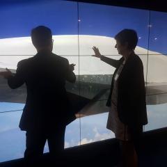 Dignitaries learn more about joint UQ-Boeing initiatives via a massive digital touch screen