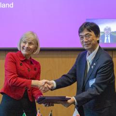 Professor Deborah Terry and Professor Kazuhiro Chiba shake hands after signing the memorandum of understanding.
