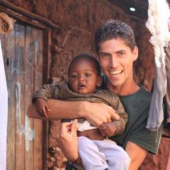 nathan taiaroa in Africa with young child