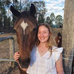 Annika posing next to horse